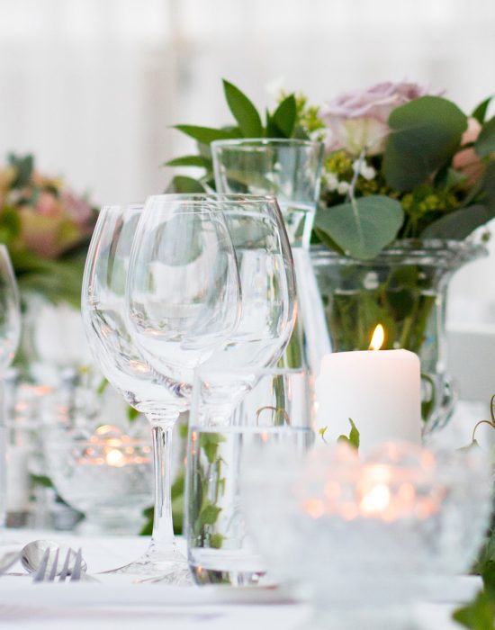 Wine glasses on a white wedding table