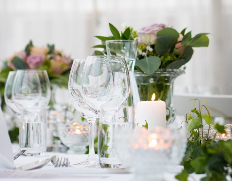 Wine glasses on a white wedding table