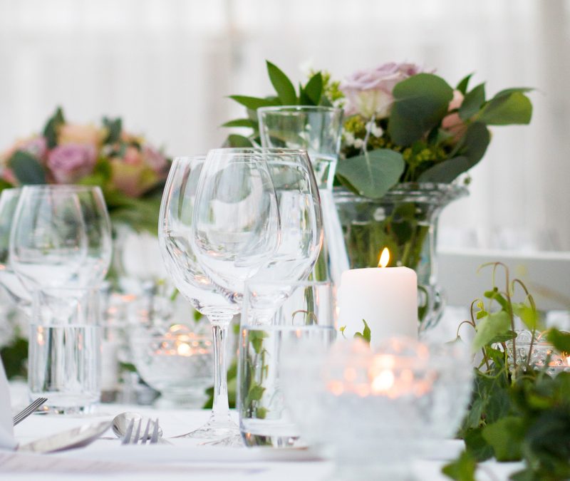 Wine glasses on a white wedding table
